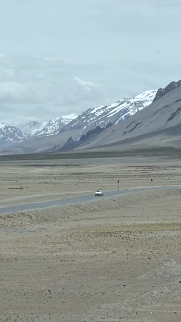 Vertical Aerial View of Vehicle on Mountain Road in Ladakh, India