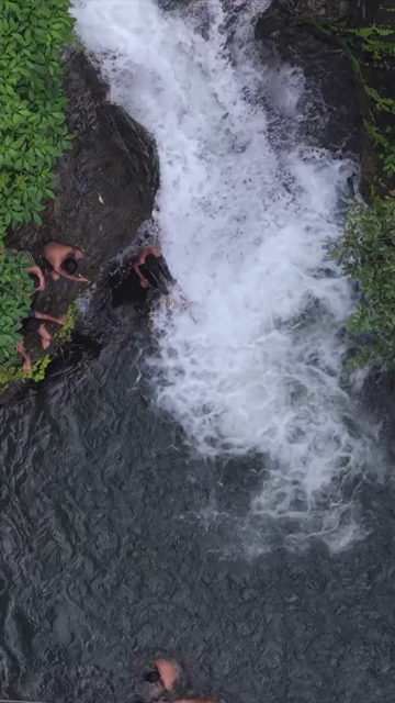 Vertical Aerial View of Vibhuti Waterfall Pool with People Bathing Karnataka