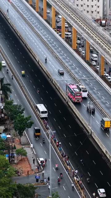 Vertical Aerial View of Waterlogged Road and Metro Corridor After Heavy Rain in Bengaluru India