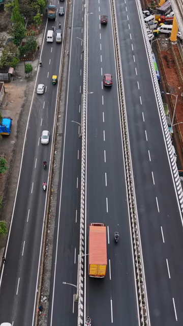 Vertical Aerial View of Waterlogged Road and Metro Corridor After Heavy Rain in Bengaluru India