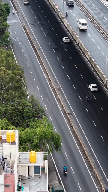 Vertical Aerial View of Waterlogged Road and Metro Corridor After Heavy Rain in Bengaluru India