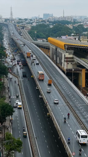 Vertical Aerial View of Waterlogged Road and Metro Corridor After Heavy Rain in Bengaluru India