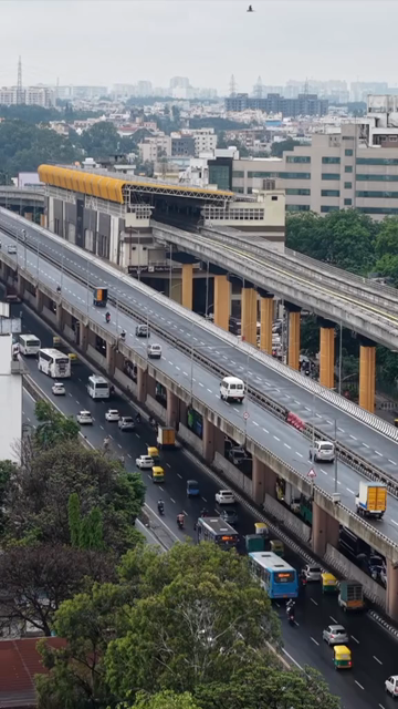 Vertical Aerial View of Waterlogged Road and Metro Corridor After Heavy Rain in Bengaluru India
