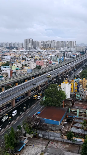 Vertical Aerial View of Waterlogged Road and Metro Corridor After Heavy Rain in Bengaluru India
