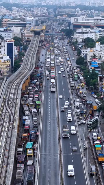 Vertical Aerial View of Waterlogged Road and Metro Corridor After Heavy Rain in Bengaluru India