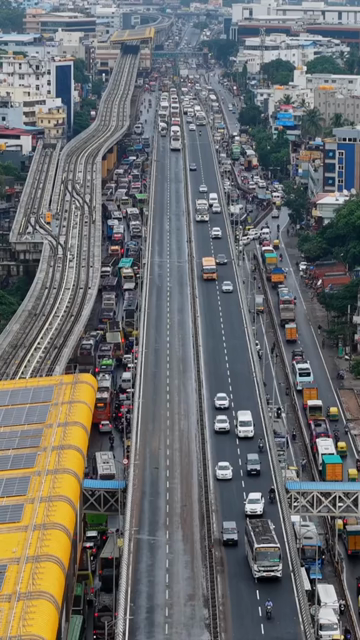 Vertical Aerial View of Waterlogged Road and Metro Corridor After Heavy Rain in Bengaluru India