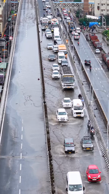 Vertical Aerial View of Waterlogged Road and Metro Corridor After Heavy Rain in Bengaluru India