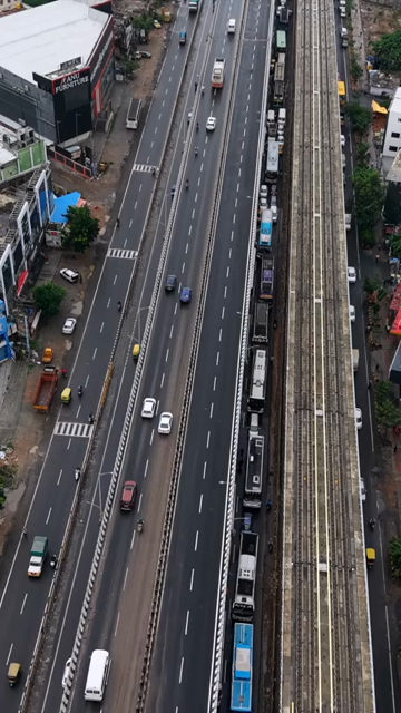 Vertical Aerial View of Waterlogged Road and Metro Corridor After Heavy Rain in Bengaluru India