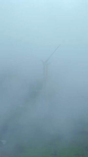 Vertical Aerial View of Wind Turbine in Misty Monsoon Landscape Ratnagiri Maharashtra India