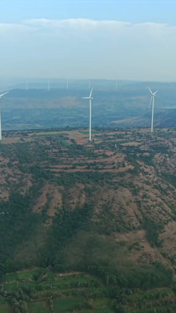Vertical Aerial View of Wind Turbines and Mountain Landscape Goa
