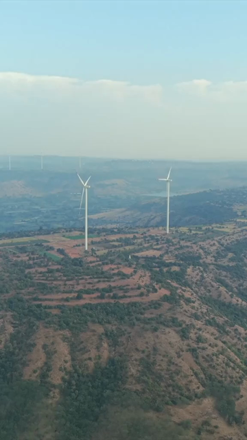 Vertical Aerial View of Wind Turbines and Mountain Landscape Goa