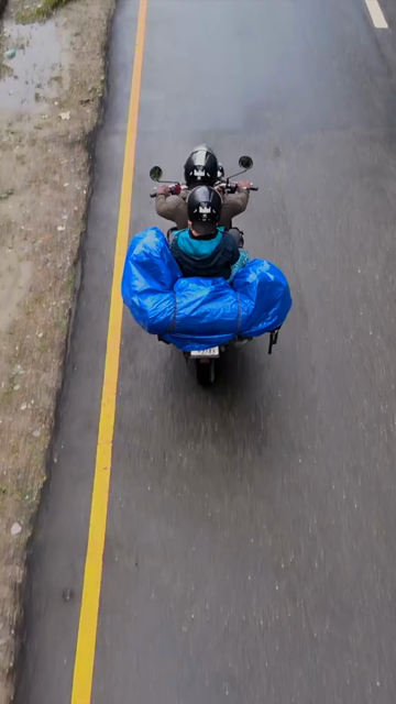 Vertical Aerial View of bike Rider on Mountain Road in Arunachal Pradesh India