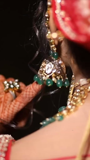 Vertical Close-Up Shot of Indian Bride Showcasing Traditional Jhumka Earrings