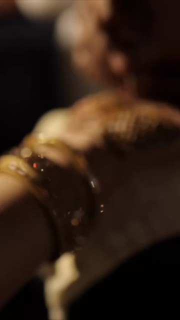 Vertical Close Up of Mehendi Applying on Bride's Hand