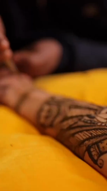 Vertical Close Up of Mehendi Applying on Bride's Hand