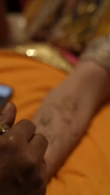 Vertical Close Up of Mehendi Applying on Bride's Hand