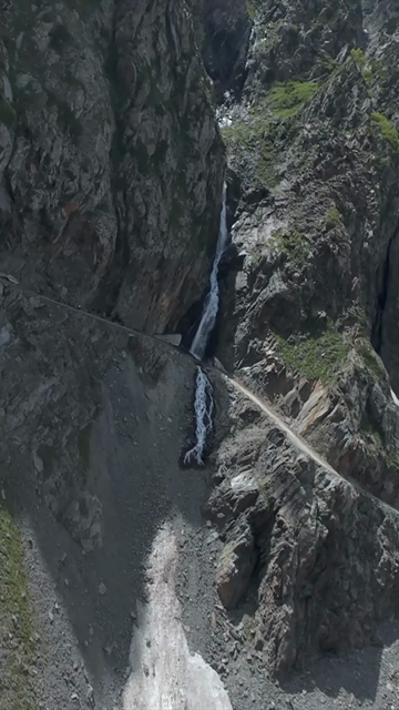 Vertical FPV Drone View of Mountain Waterfall in Ladakh, India