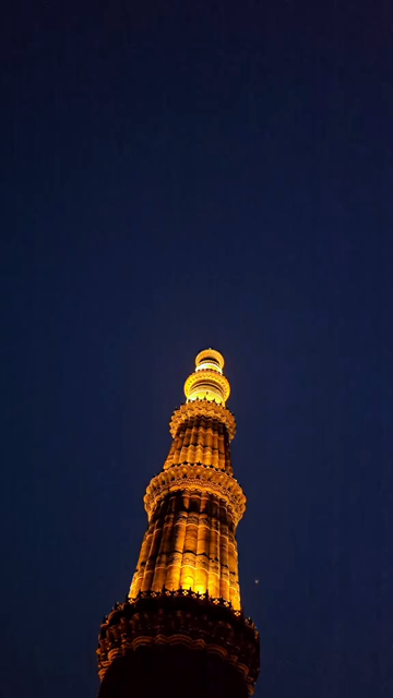 Vertical Night View of Illuminated Qutub Minar Delhi India