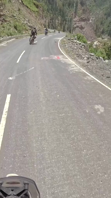 Vertical POV of Adventure Motorcycle Ride on Scenic Himalayan Road in Ladakh