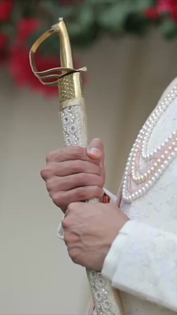 Vertical Portrait of Groom Posing in Traditional Wedding Attire