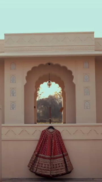 Vertical Shot of Bridal Lehenga Hanging at Wedding Ceremony