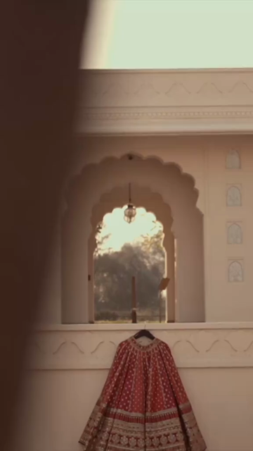 Vertical Shot of Bridal Lehenga Hanging at Wedding Ceremony