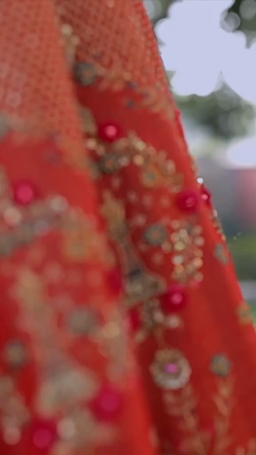 Vertical Shot of Bridal Lehenga Hanging at Wedding Ceremony