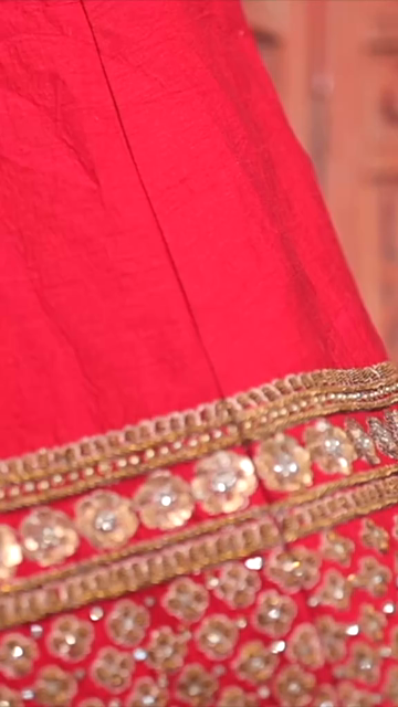 Vertical Shot of Bridal Lehenga Hanging at Wedding Ceremony