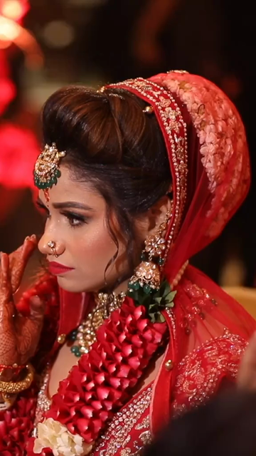 Vertical Shot of Bride Performing Wedding Ritual During Traditional Indian Wedding