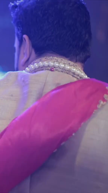 Vertical Shot of Bride and Groom Dancing Together at Their Indian Wedding