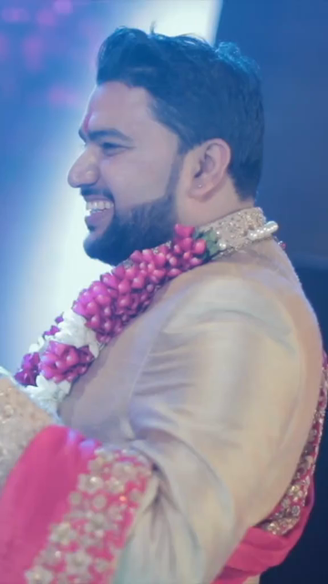 Vertical Shot of Bride and Groom Dancing Together at Their Indian Wedding