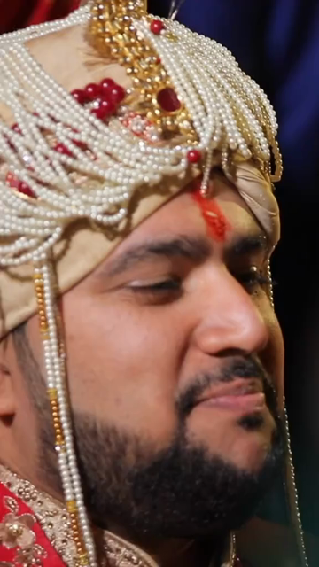 Vertical Shot of Groom Being Fed Sweets During His Indian Wedding Ceremony