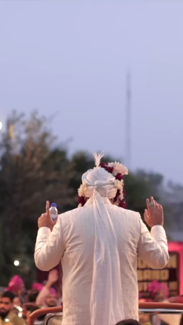 Vertical Shot of Groom Dancing During Baraat Celebration at Indian Wedding