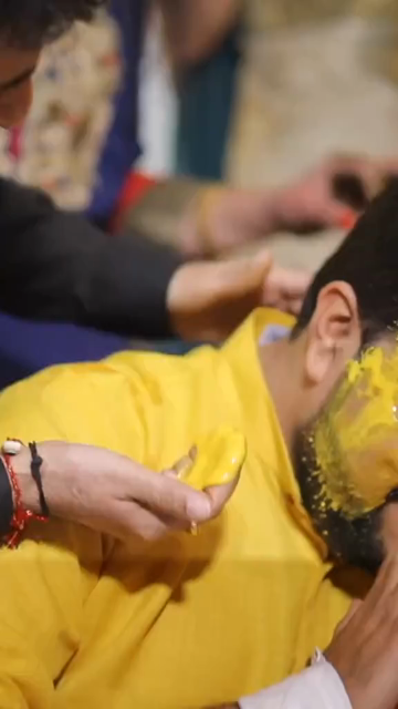 Vertical Shot of Groom During Haldi Ceremony at Indian Wedding