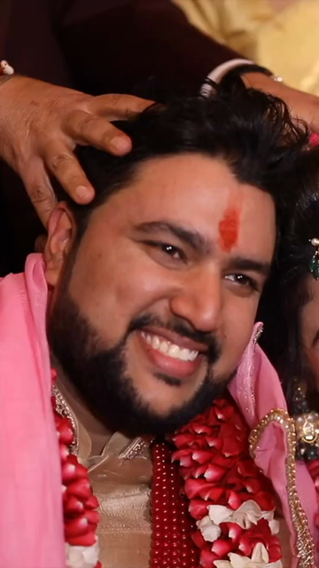 Vertical Shot of Indian Bride and Groom Posing Together at Their Wedding