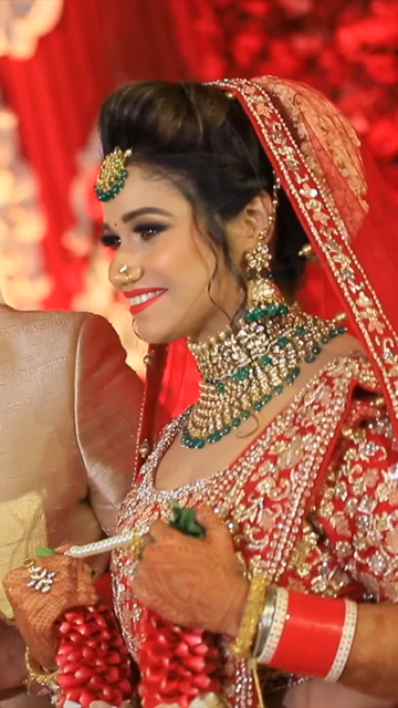 Vertical Shot of Indian Bride and Groom Posing Together at Their Wedding