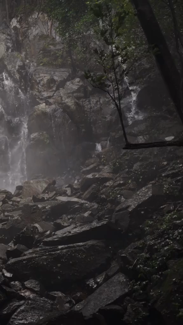 Vertical Shot of Man Standing near Motigudda Waterfall at Karnataka India