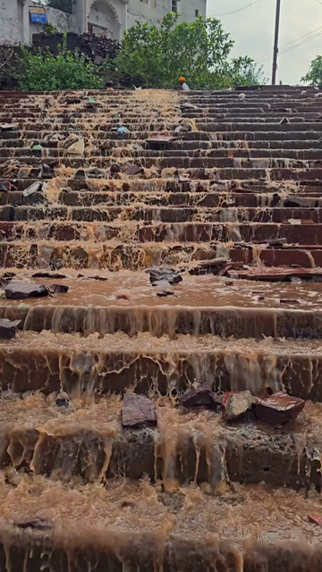 Vertical Shot of Water Flowing Over Steps at Omkareshwar, India