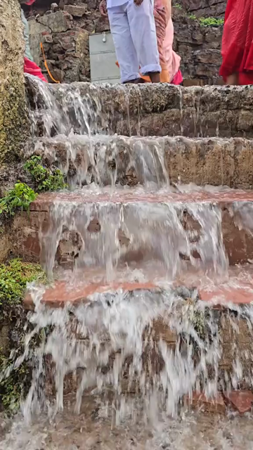 Vertical Shot of Water Flowing Over Steps at Omkareshwar, India