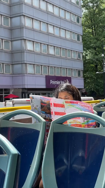 19th June 2024 : Vertical Shot of Woman Traveling on Open Top Sightseeing Bus in London England