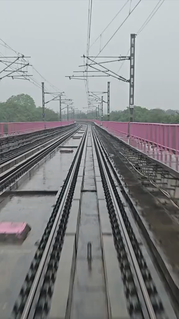 Vertical Timelapse View of Delhi Metro Tracks in Rain, Delhi, India