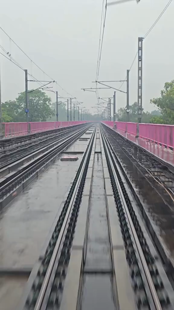 Vertical View of Delhi Metro Tracks in Rain, Delhi, India